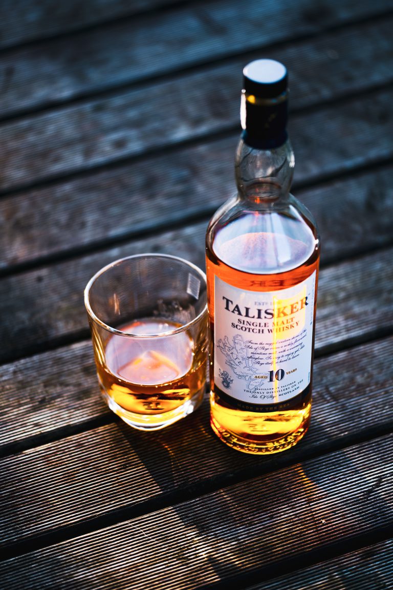 Talisker bottle beside drinking glass