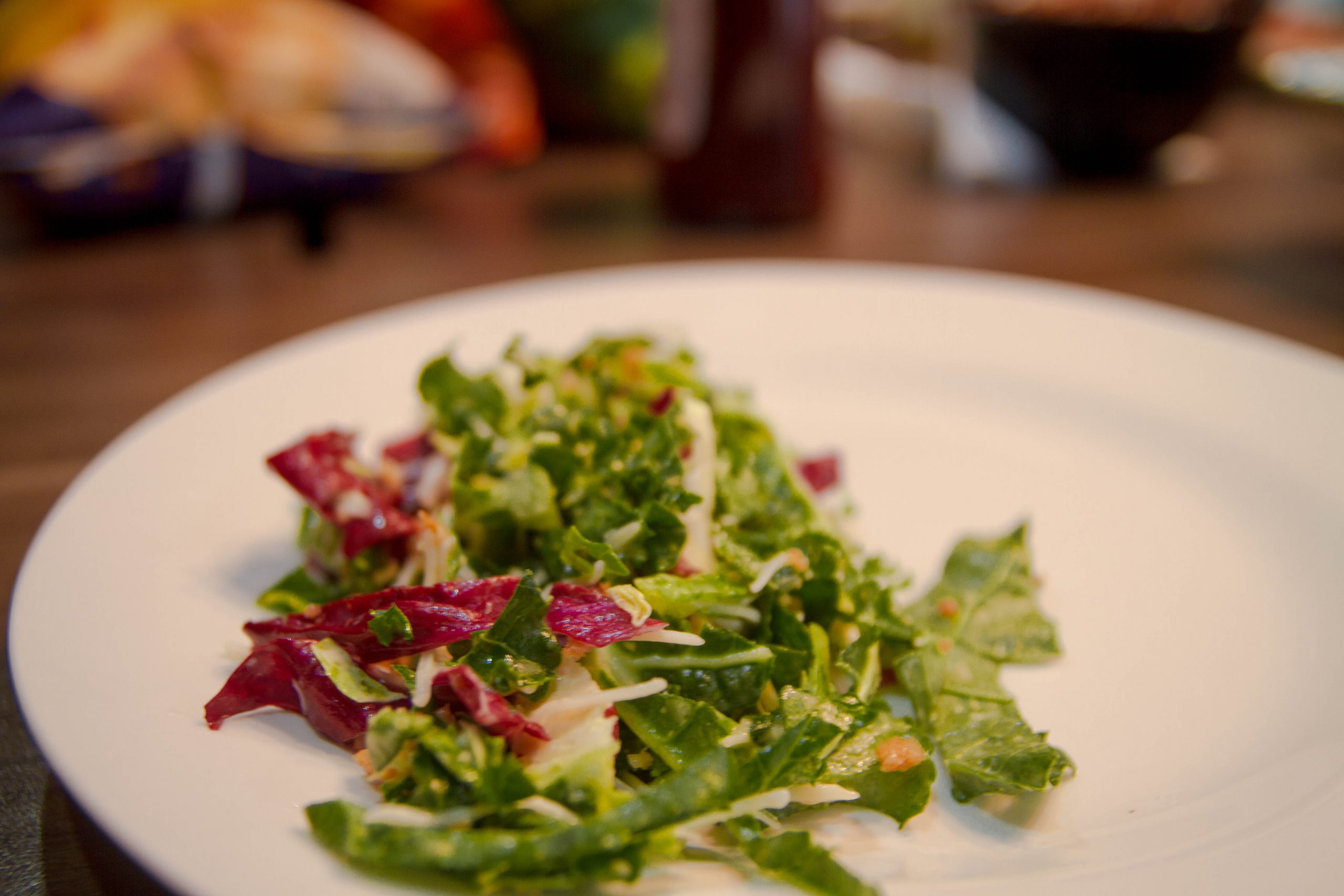 mixed vegetable salad in round white ceramic plate