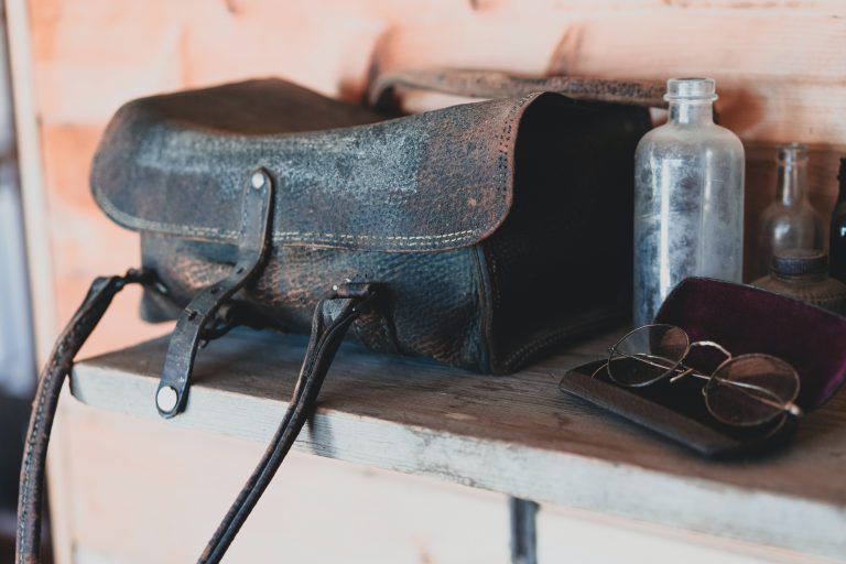 black leather bag close-up photography